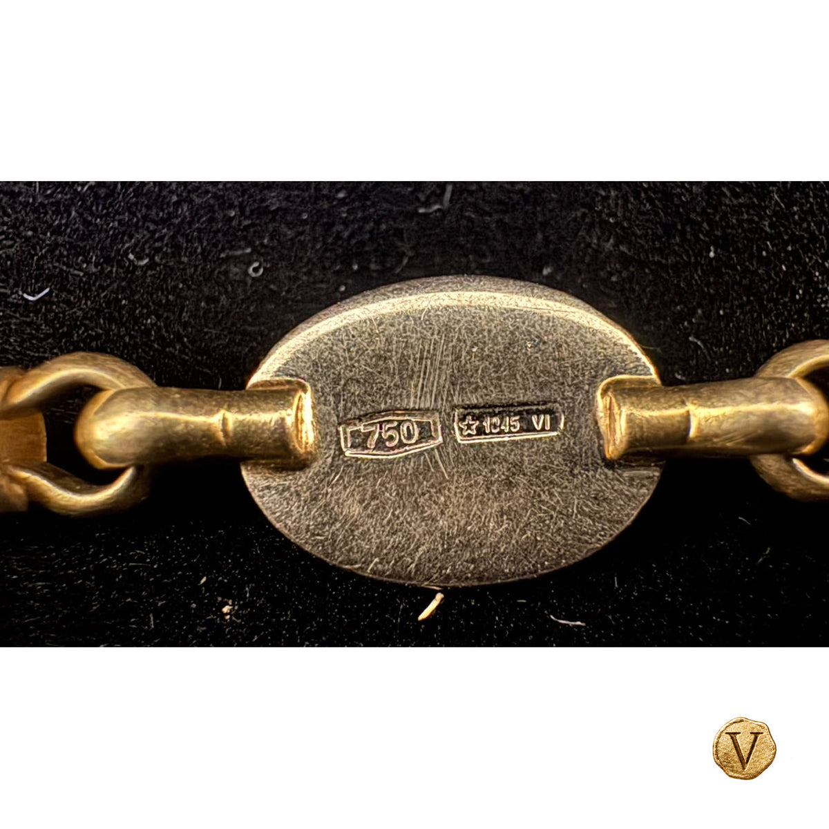Original 750 and Italian maker’s mark photograph with gold V seal
