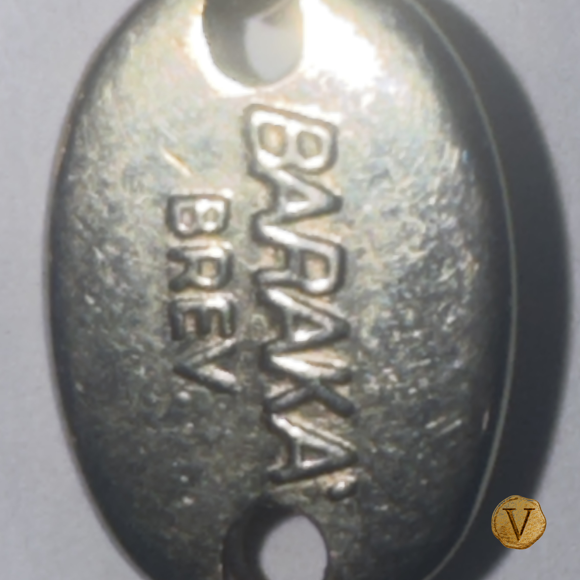 Original BARAKA BREV. signature plaque photographed on the necklace, with Victoire V stamp