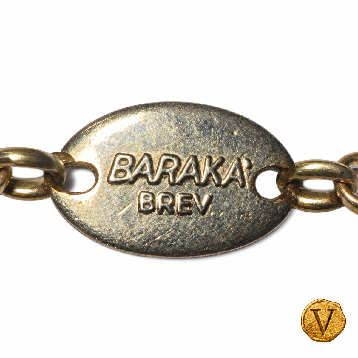 Barakà signature plaque and links, retouched detail view