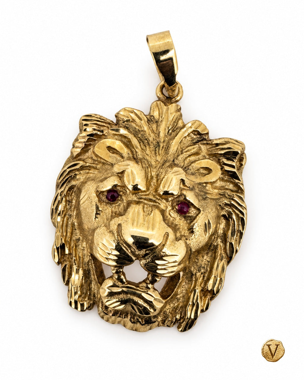 Angled view of a 9ct yellow gold lion-head pendant showing its carved mane and sapphire eyes